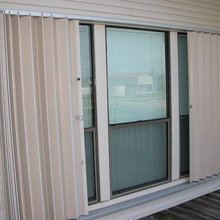 Hurricane shutters - rolldown / accordion