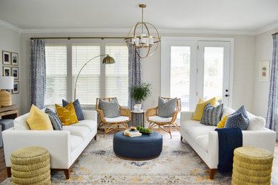 Inspiration for a mid-century modern medium tone wood floor living room remodel in Charleston with beige walls