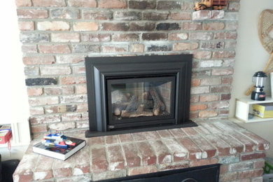 raised hearth fireplace with woodbox
