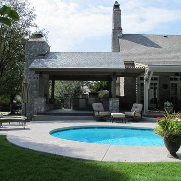 Stone Outdoor Kitchen Addition with Fireplace and Hasty-Bake Charcoal Grill