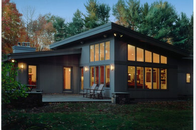 Inspiration for a modern gray wood exterior home remodel in New York
