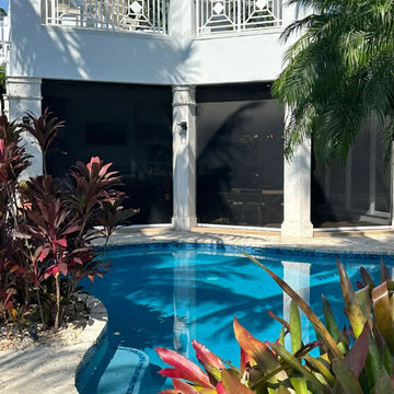 Seamless Modern Oasis: Large-Openings and Motorized Hurricane Screens