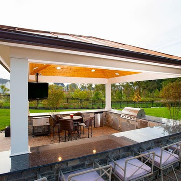 Design Builders Trex deck and outdoor kitchen with copper roof pavilion in Fulto