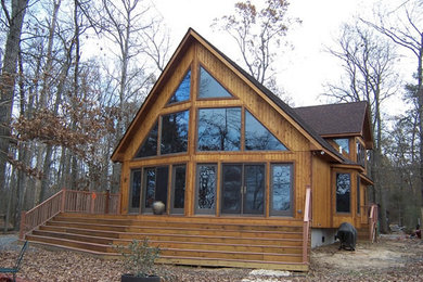 Large craftsman brown two-story wood exterior home idea in Baltimore with a shingle roof