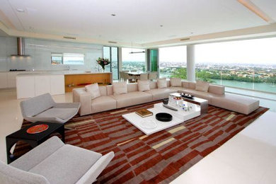 Large modern open concept living room in Brisbane with white walls and porcelain floors.