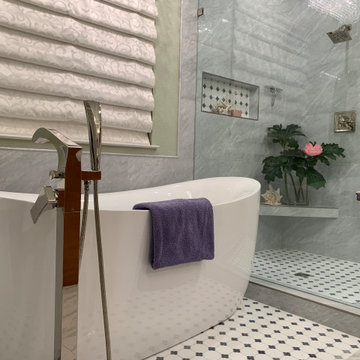 JETTED TUB IS NESTLED NEXT TO THE SHOWER