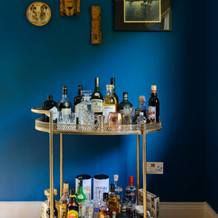 This is an example of an eclectic bar cart in Other with medium hardwood floors and brown floor.