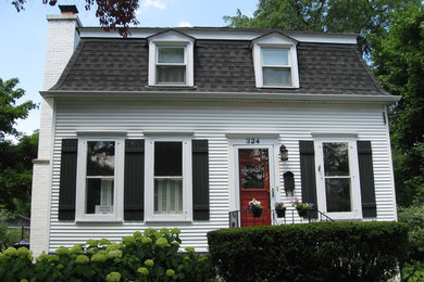 Craftsman white two-story vinyl exterior home idea in Chicago with a gambrel roof