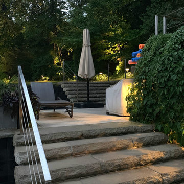 Infinity pool, patio, and landscape lighting in Toronto