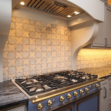 Combining Stucco and Stone bring charm to this Country French