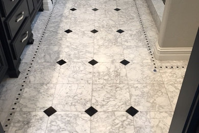 Inspiration for a mid-sized transitional master porcelain tile ceramic tile and white floor alcove shower remodel in Other with raised-panel cabinets, brown cabinets and gray walls
