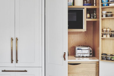 Example of a classic kitchen design in Columbus with recessed-panel cabinets and white cabinets
