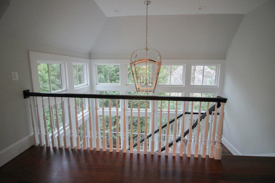 Powerful Impression by Floating Staircase in Suburban Foyer