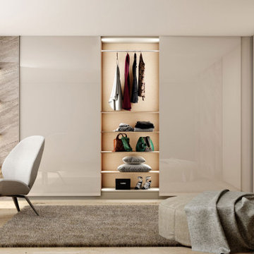 Bespoke frameless sliding door wardrobe L shape supplied by Inspired Elements