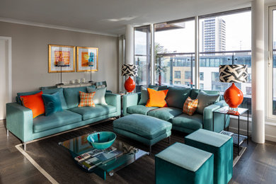 Medium sized modern formal open plan living room in London with beige walls, medium hardwood flooring and brown floors.