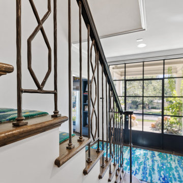 Stylish Foyer with Modern Glass Door and Bold Decorative Accents
