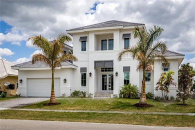 Example of a large two-story house exterior design in Miami