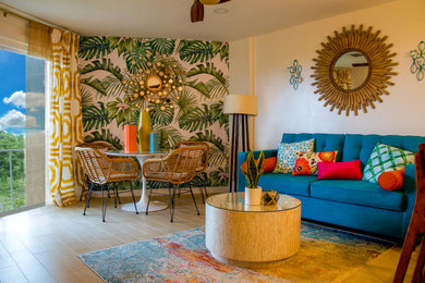 Example of a beach style formal and open concept light wood floor and beige floor living room design in DC Metro with white walls and no fireplace