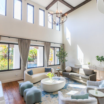 Sunlit Great Room with Exposed Beam Ceiling