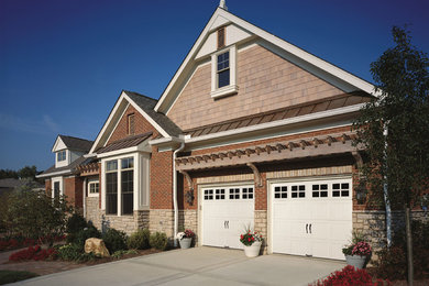 Mid-sized arts and crafts attached two-car garage photo in Raleigh