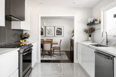 Eat-in kitchen - mid-sized modern galley ceramic tile and beige floor eat-in kitchen idea in Toronto with an undermount sink, flat-panel cabinets, white cabinets, quartzite countertops, stainless steel appliances and no island
