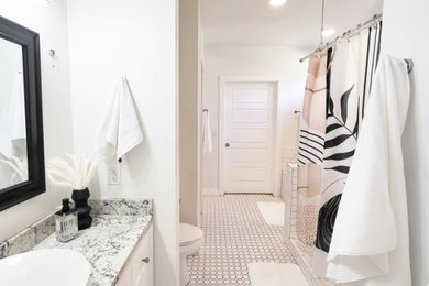 Inspiration for a small eclectic master white tile and subway tile ceramic tile, white floor and single-sink bathroom remodel in Jacksonville with shaker cabinets, white cabinets, a hot tub, a one-piece toilet, white walls, granite countertops, white countertops and a built-in vanity