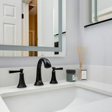 Minimalist Vanity with Modern Black Hardware and Framed Mirror