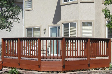 Inspiration for a mid-sized timeless backyard deck remodel in Denver with no cover