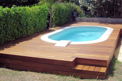 Inspiration for a contemporary pool in Nice with decking.