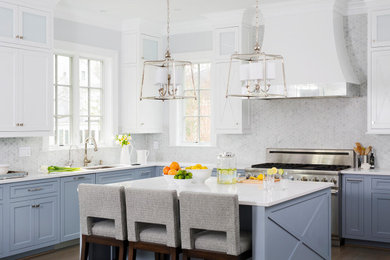 Kitchen - large transitional l-shaped dark wood floor and brown floor kitchen idea in DC Metro with an undermount sink, recessed-panel cabinets, blue cabinets, quartz countertops, gray backsplash, mosaic tile backsplash, stainless steel appliances, an island and white countertops