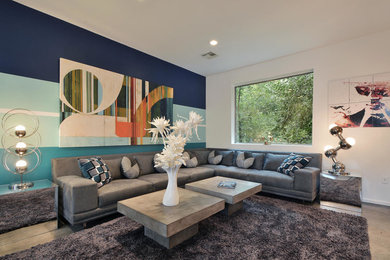 Example of a trendy formal concrete floor living room design in Austin with multicolored walls, no fireplace and no tv