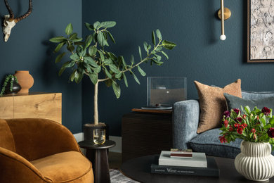 Living room - mid-sized eclectic light wood floor and brown floor living room idea in Austin with blue walls