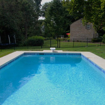 Classic Rectangle style in-ground salt water pool with diving board