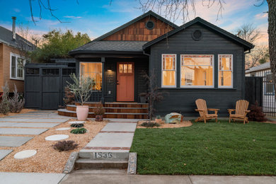 Example of a mid-sized arts and crafts blue one-story wood and board and batten exterior home design in Sacramento with a shingle roof and a gray roof