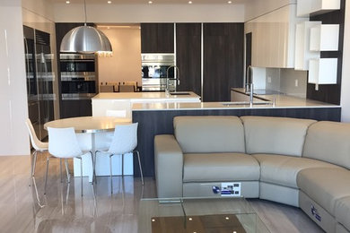 Large minimalist open concept porcelain tile and beige floor family room photo in Miami with white walls, a wall-mounted tv and no fireplace