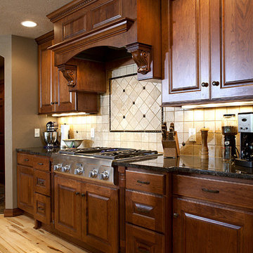 Door style: Covington W | Species: Cherry | Finish: Autumn with Walnut glaze