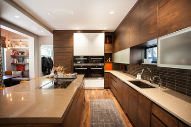 Inspiration for a large modern u-shaped medium tone wood floor eat-in kitchen remodel in Denver with an undermount sink, flat-panel cabinets, dark wood cabinets, quartzite countertops, brown backsplash, ceramic backsplash, paneled appliances and an island