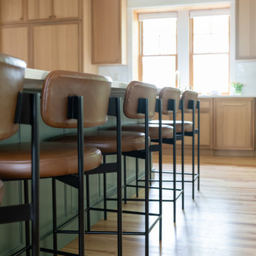 Warm Modern Kitchen Renovation with Natural Oak & Green Accents