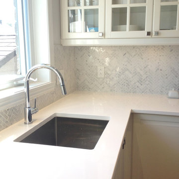 Stéphanie Fortier Design - White Quartz counter tops with soft gray marble backs