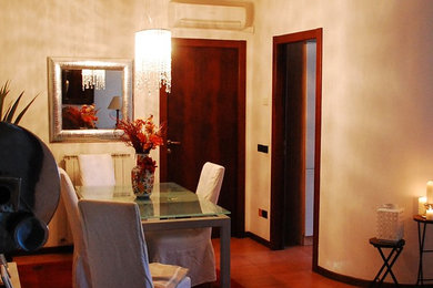 Inspiration for a mid-sized timeless ceramic tile great room remodel in Other with white walls and no fireplace