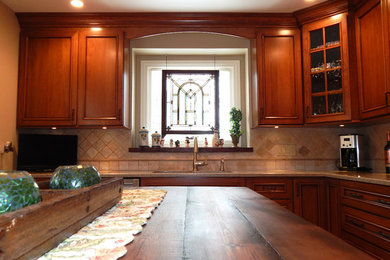 Kitchen - craftsman kitchen idea in Chicago with beaded inset cabinets, medium tone wood cabinets, wood countertops, beige backsplash, stone tile backsplash and an island