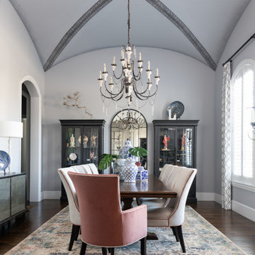 Vaulted Dining Room Ceiling with White Dining Chairs & Colorful Host Hostess Cha