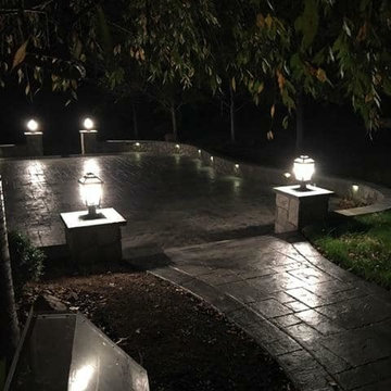 T-Stamped concrete patio, flagstone wall with columns