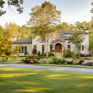 Design ideas for a large country home design in Little Rock.