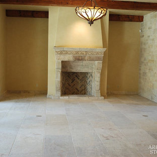 Design ideas for a medium sized mediterranean formal open plan living room in Toronto with yellow walls, limestone flooring, a standard fireplace and a stone fireplace surround.