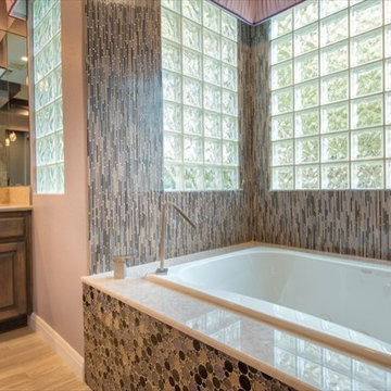 This baqth begs you to step in with the glass and buble tiles.