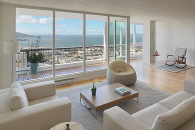 Inspiration for a mid-sized modern open concept light wood floor and brown floor living room remodel in San Francisco with white walls, no fireplace and no tv
