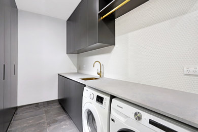 This is an example of a contemporary laundry room in Other.