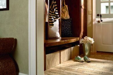 Design ideas for a mid-sized transitional mudroom in Orange County with beige walls, brick floors, a dutch front door, a white front door and beige floor.