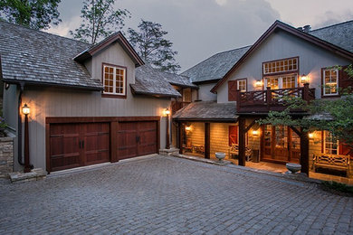 Inspiration for a large rustic gray three-story mixed siding exterior home remodel in Huntington with a shingle roof